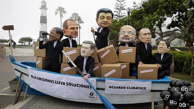 Keep rowing: Environmental activists perform as world leaders at the UN-sponsored climate change conference in Lima, Peru, in December. The next UN conference, in Paris this fall, will set new targets for national emissions reductions.