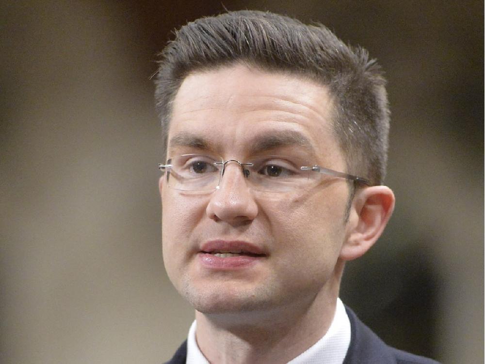 Minister of State (Democratic Reform)Pierre Poilievre speaks during question period in the House of Commons on Parliament Hill in Ottawa, Thursday May 1, 2014 .