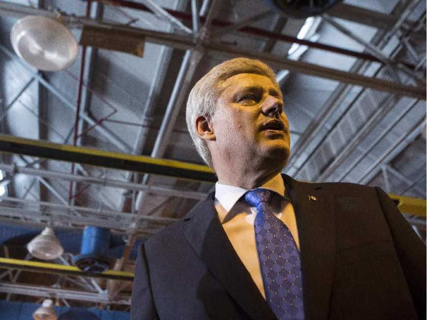 Prime Minister Stephen Harper greets guests after making a policy statement in Toronto on June 18, 2015. 
