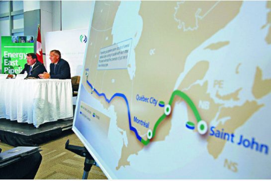TransCanada President and CEO Russ Girling (2nd L) announces the new Energy East Pipeline during a news conference in Calgary, Alberta in this August 1, 2013 file photo.