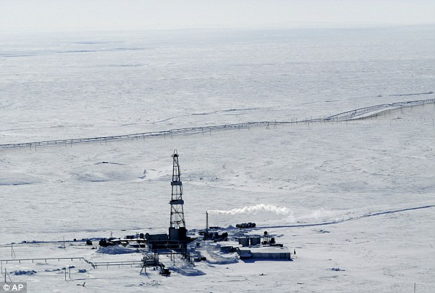 Claim: The Arctic Circle is the only region in the world where borders remain unregulated, which is sparking international tension over its valuable resources. Pictured, a drilling rig at the Val Gamburtseva oil fields in Russia's Arctic Far North