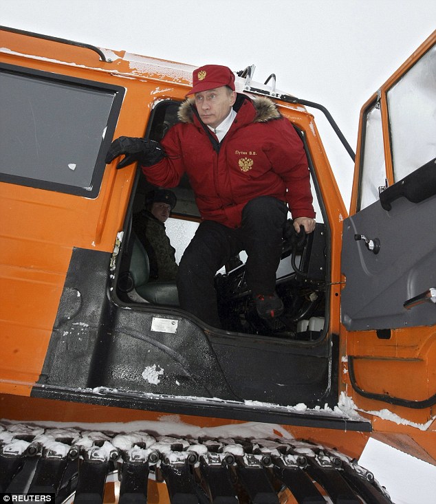 Force: Vladimir Putin’s plan includes the construction of some 13 airfields and 10 radar posts in the Arctic, whose assets also include thriving fisheries. Pictured, Vladimir Putin on a visit to Alexandra Land in 2010