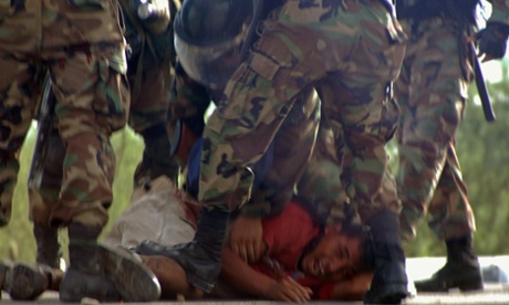 Peruvian security forces arrest a protester in June 2009 during conflict that led to more than 30 people dying and over 200 injured.